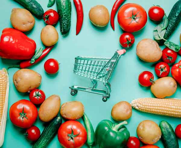 tomatoes and potatoes with shopping cart